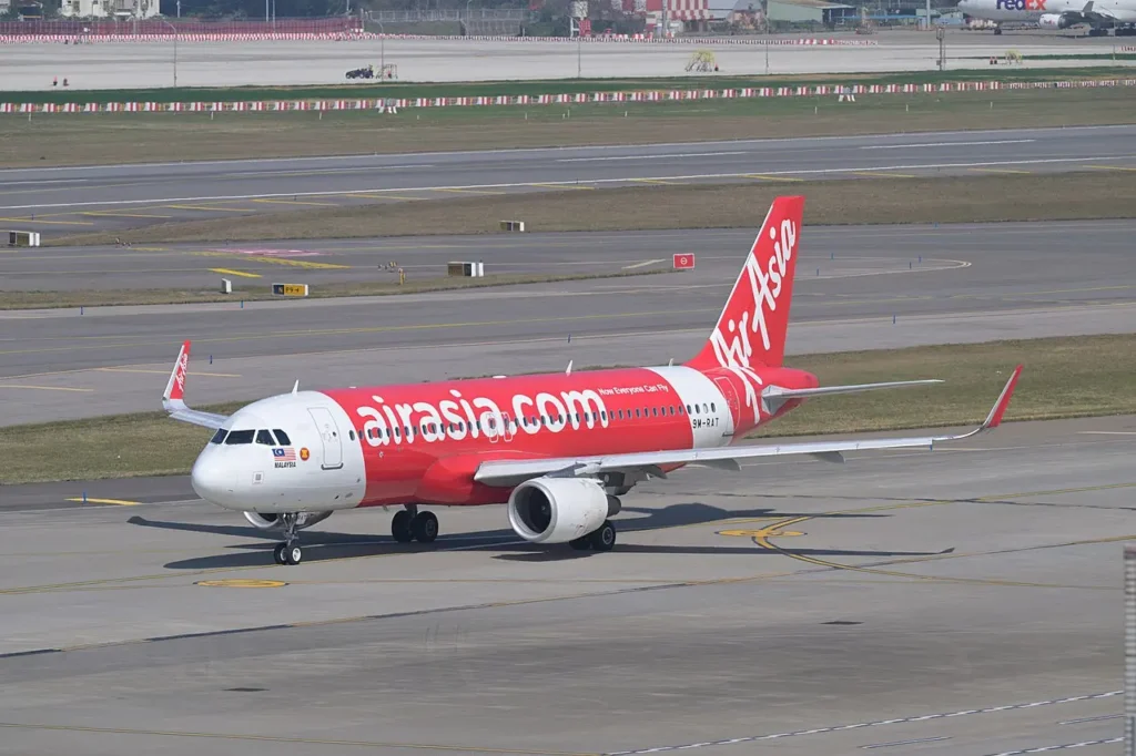 AirAsia Airbus A320 9M-RAT, operating flight 1510 to Fukuoka, taxis for departure at Taiwan Taoyuan International Airport.
